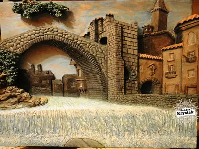 Relieve de un puente de piedra y edificios